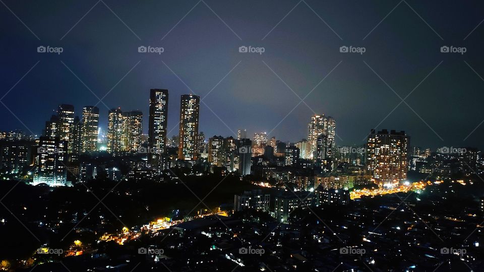 Urban Life where glow of lights from land outshines that of sky. Mumbai- City of dreams n sea of skycrapers beauty, wonderful glowing blocks of night and streets seems like golden lava poured, such view are bliss in hassle fast forward life of city.