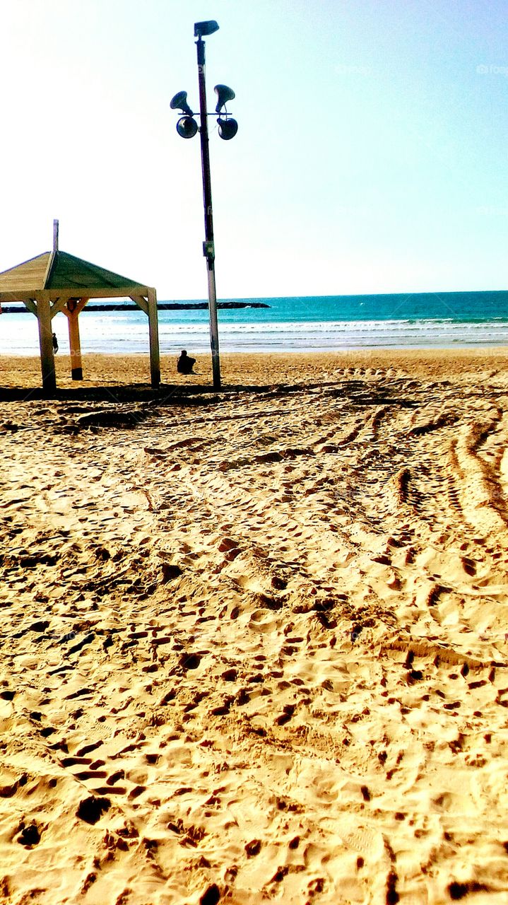 Relaxion on the beach near the blue sea in sunny beautiful day with clear blue 
sky to feel the fresh air and the positive
energy around