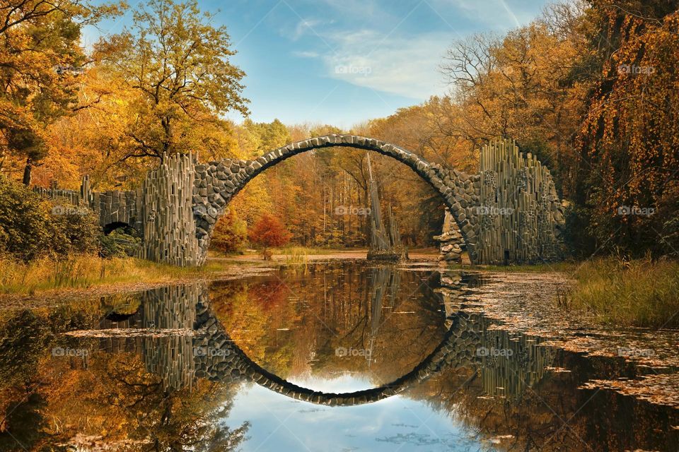 Round bridge in autumn park