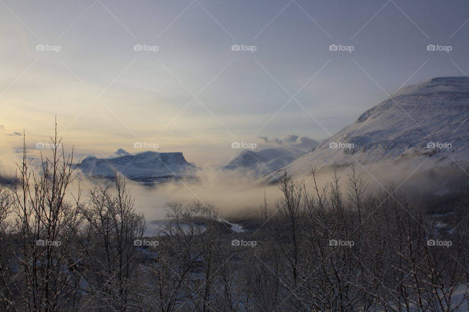 Fog covered the snowy mountain