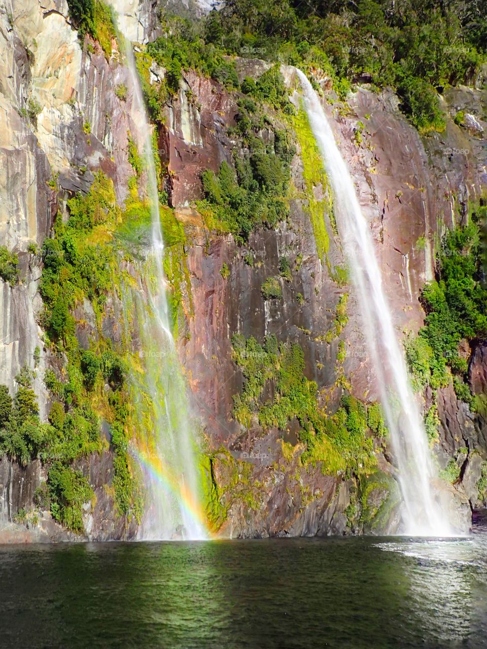 Beautiful Waterfall on Summer. Nature have the ownway to express the beauty.
This waterfall was looked shining because the sunlight and the rainbow.