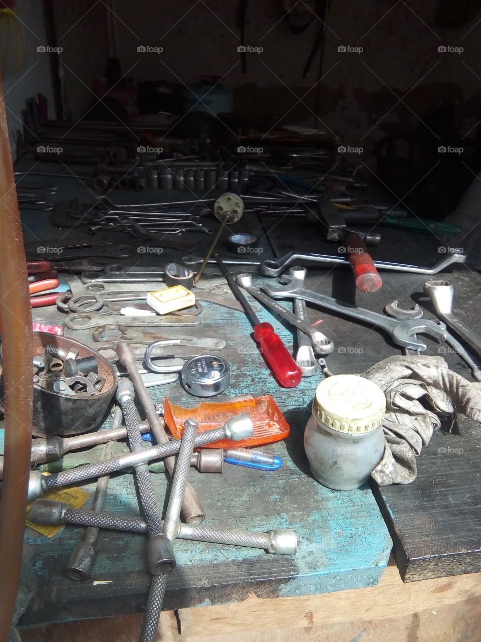 people in small job- a workshop of a motorcycle mechanic.