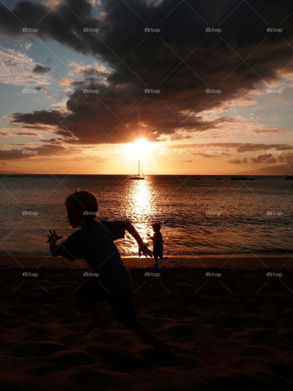 The sun reflects on the beach action