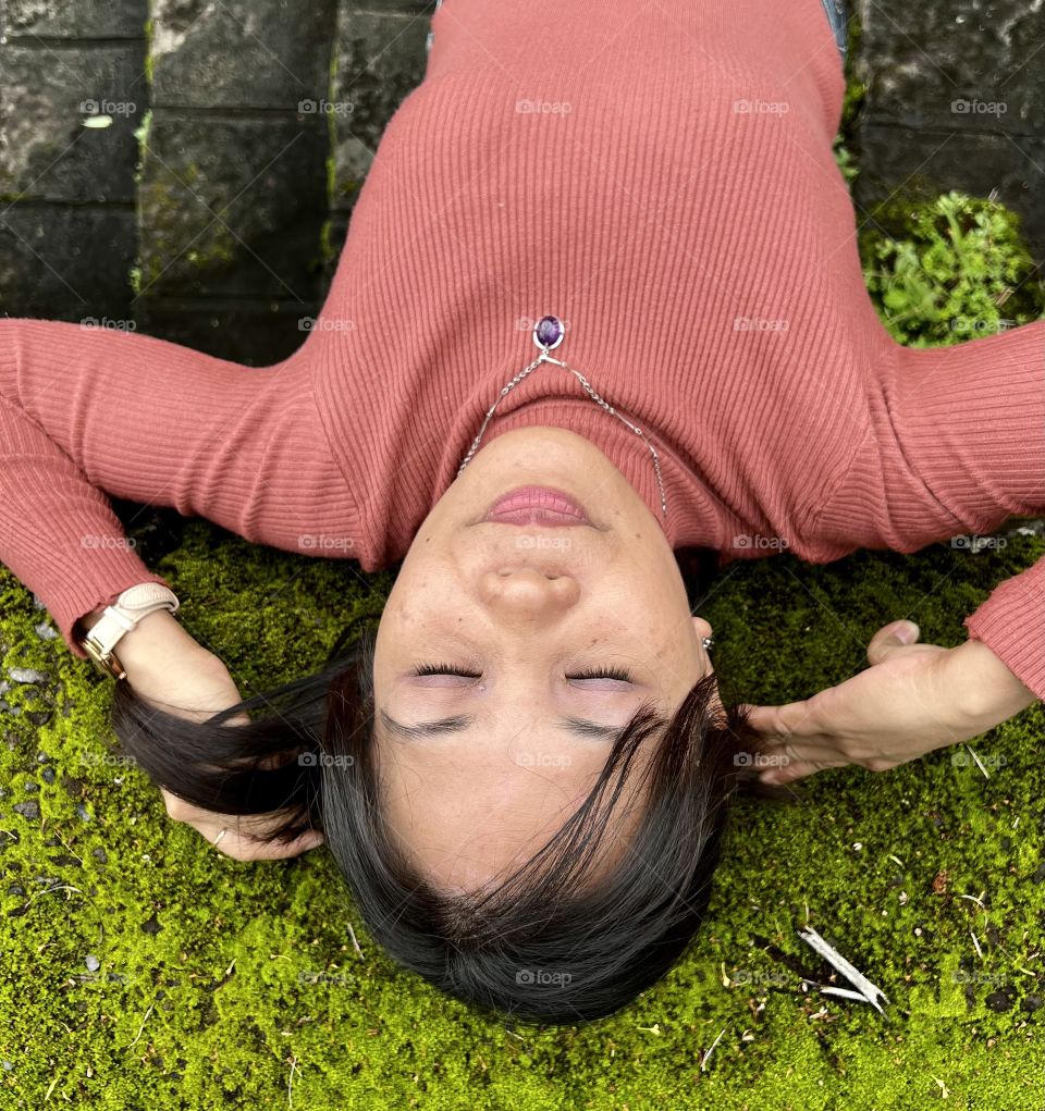 A lady lying in the floor 