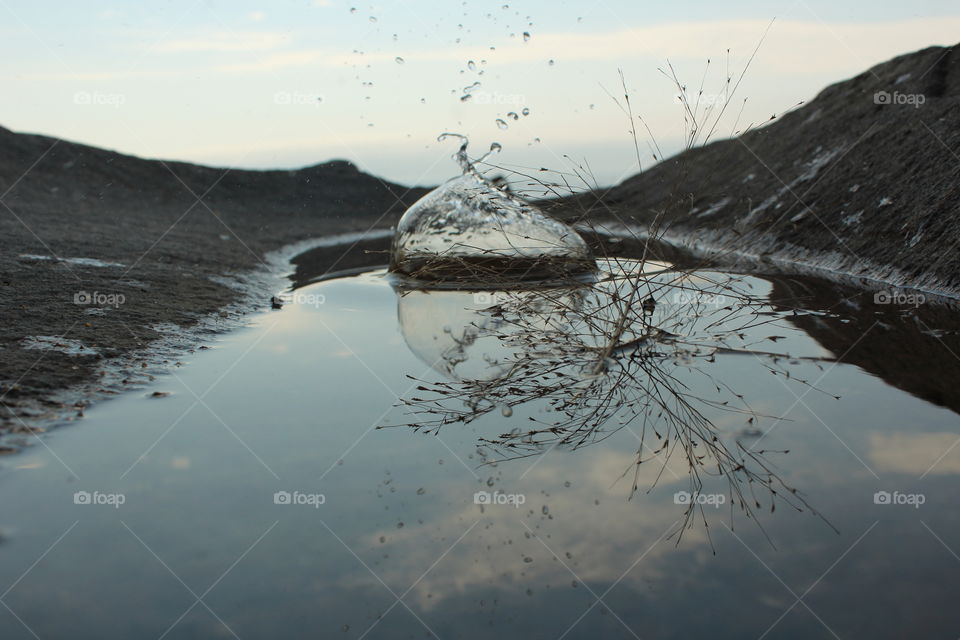 Rain drops in the puddle