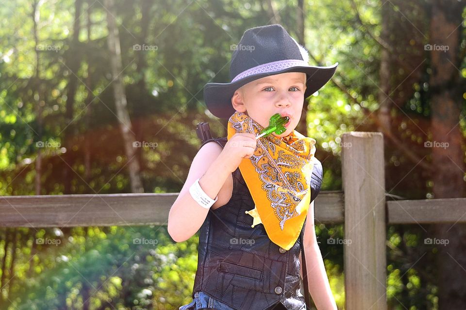 Boy . Boy eating lollipop