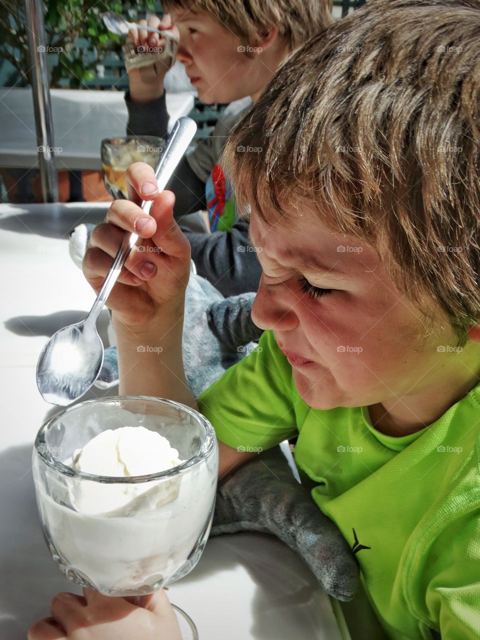 Boy Getting Brain Freeze From Ice Cream
