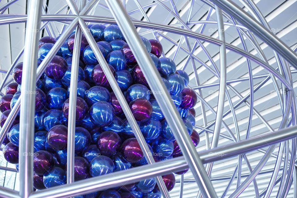 metal structure with colored balls in the center