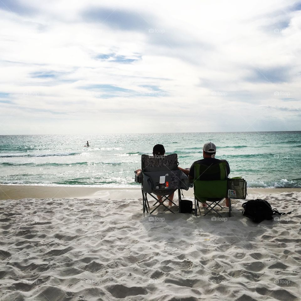 Taking in the beautiful turquoise ocean water view with my man on the beach in Panama City Beach, FL. 
