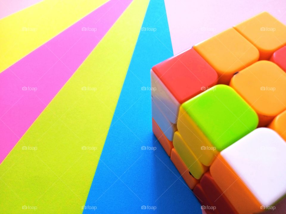 multicolored stripes and cube