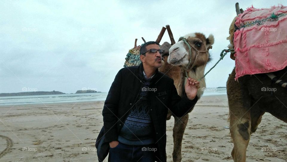 near the beach ' best moment when I hug and kiss  my camel.