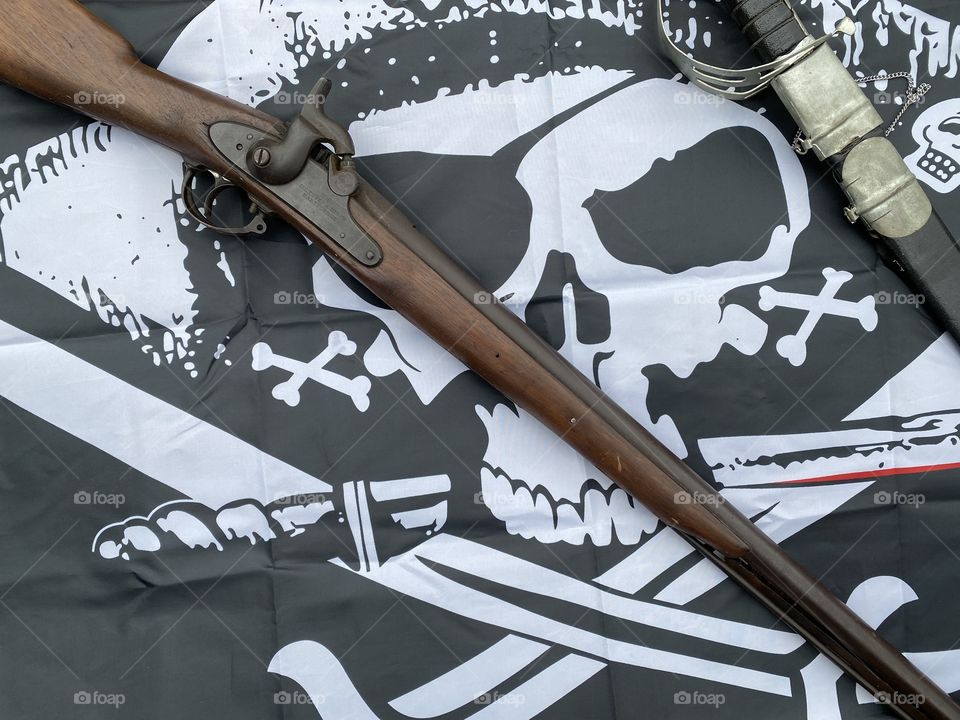 Raise the black flag fly the skull and bones 