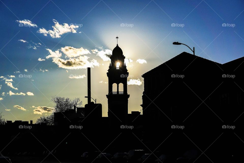 Sun peaking through a tower