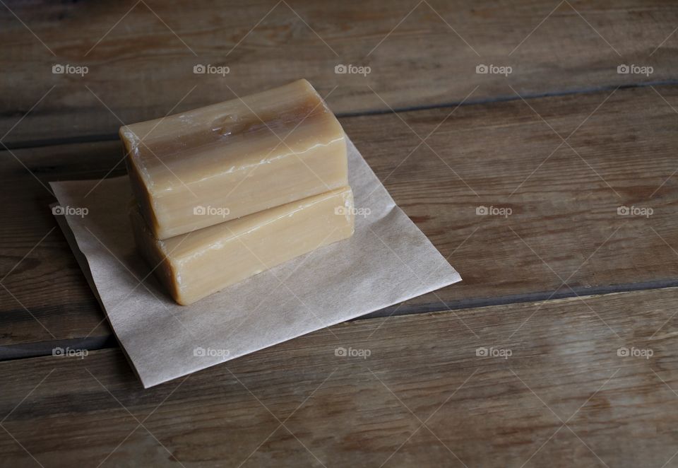 Laundry soap on a wooden background with copyspace
