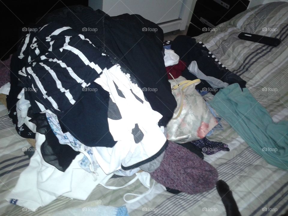 Many scattered clothes in the room