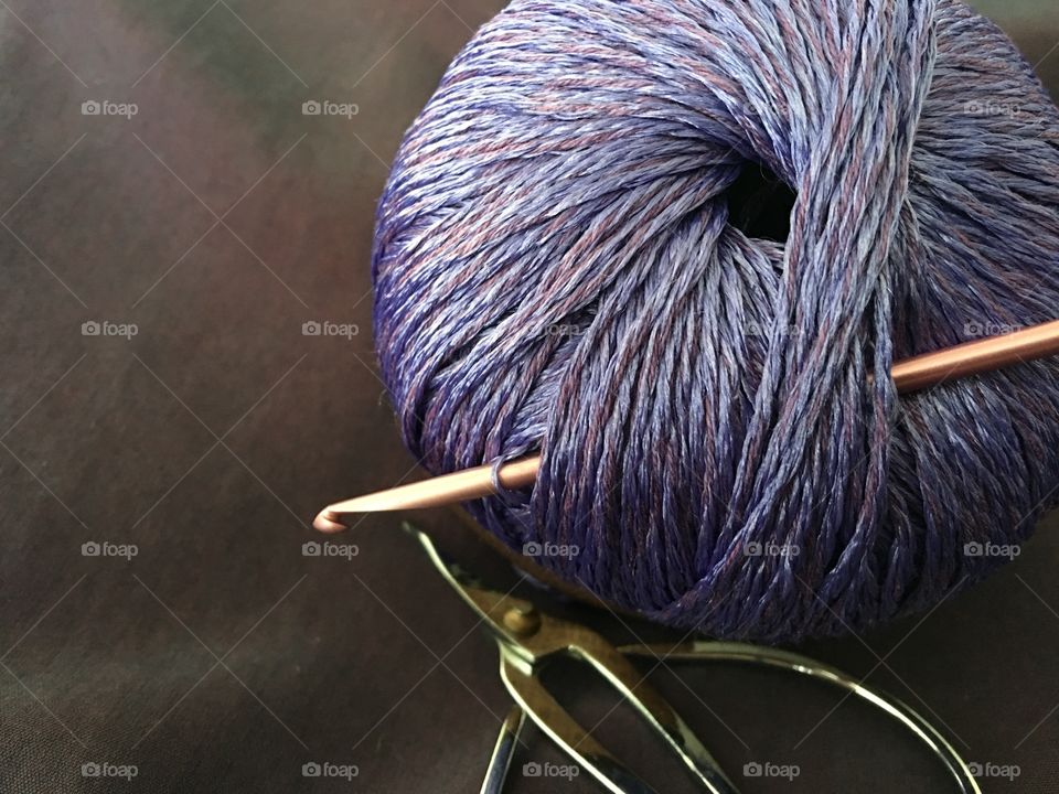 Purple yarn with craft hook