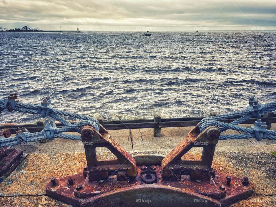 Rusty metal at the seawall 