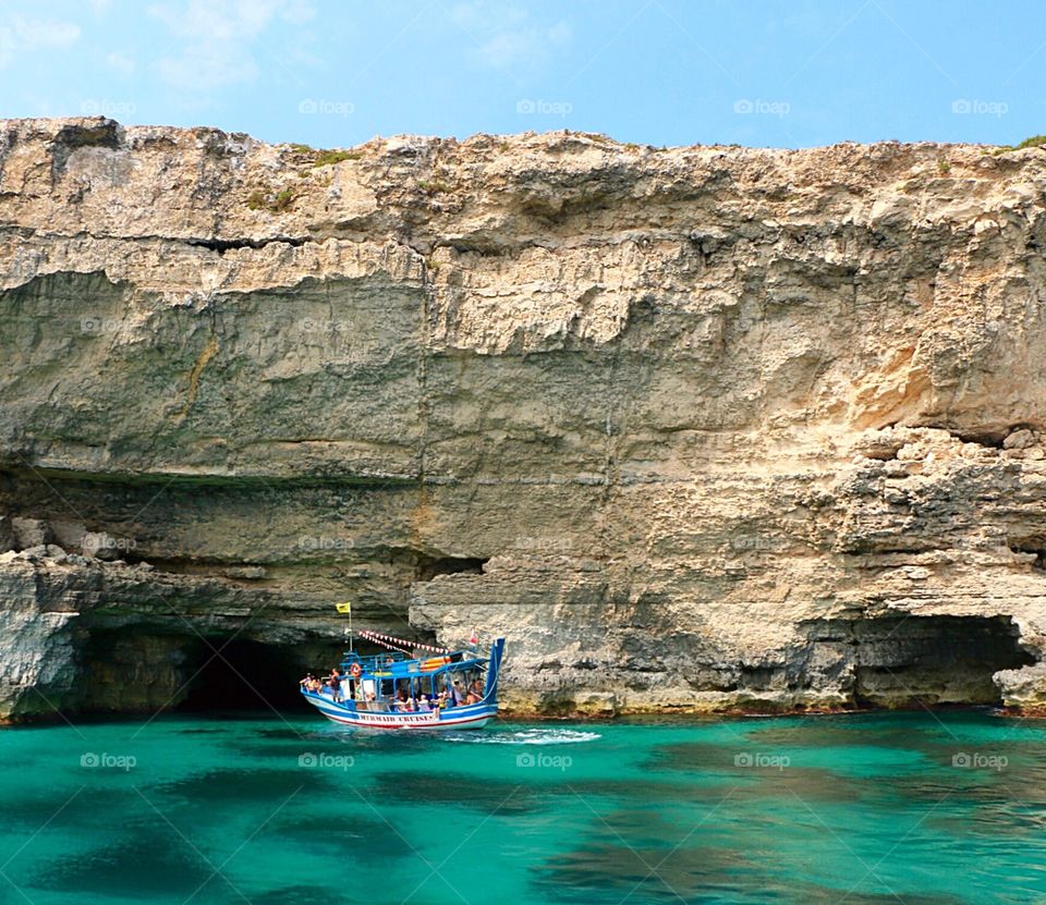 Beautiful image of Maltese caves along the edges of the island, which can be explored on boat tours! The water is so calm and perfectly clear, creating a striking turquoise base to this image!