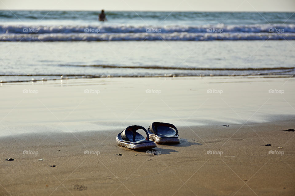 slippers in a beach