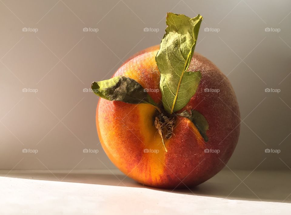 Peach with leaves