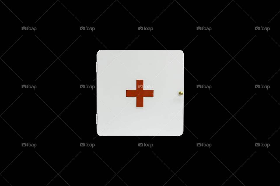 Isolated White first aid medicine cabinet on a black background with clipping path.