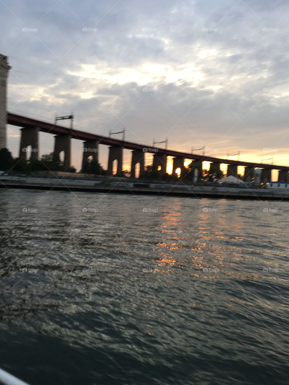 A bridge near the Throgs Neck Bridge in upper Queens we encountered in the twilight sailing southbound towards Newtown Creek in LIC, Queens, NY. 2017. Hypnotic Productions