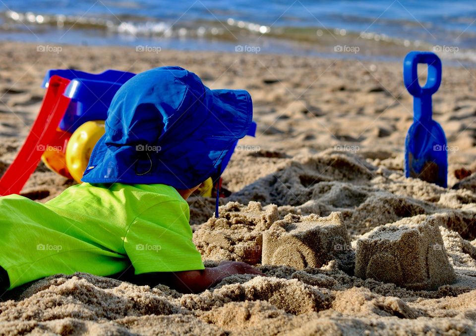 Child taking a break on the beach 