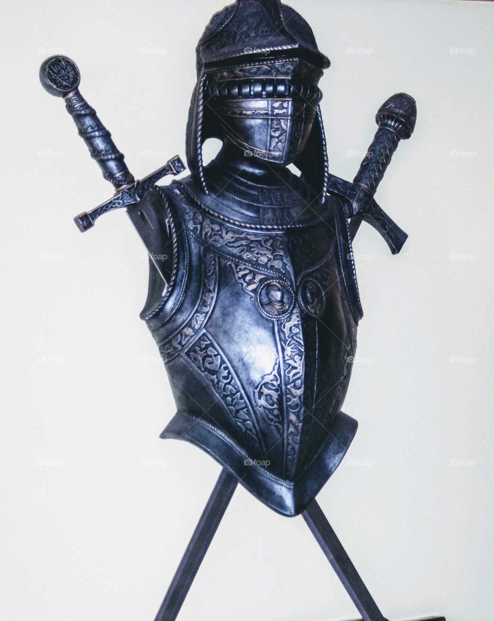 Armor and sword on background