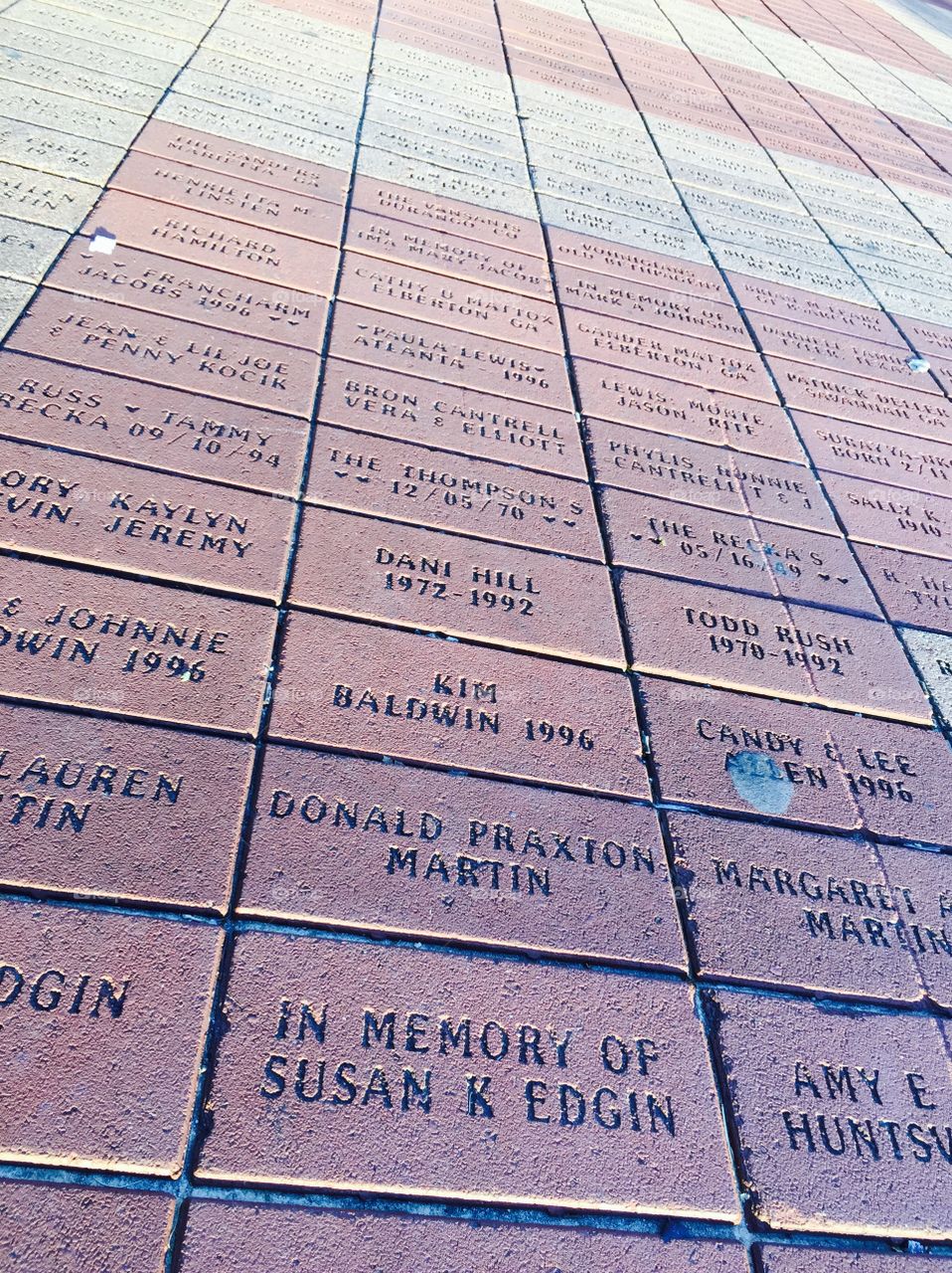 Name on pavement . Names bricks 