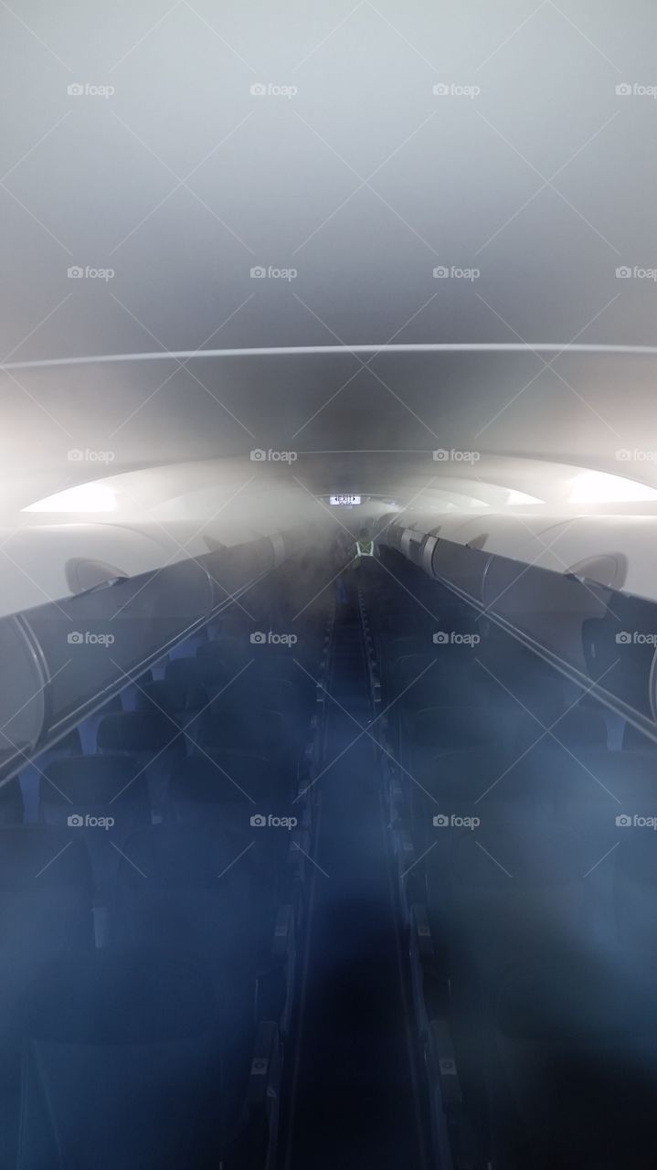 fog from the air conditioning in a aircraft cabin