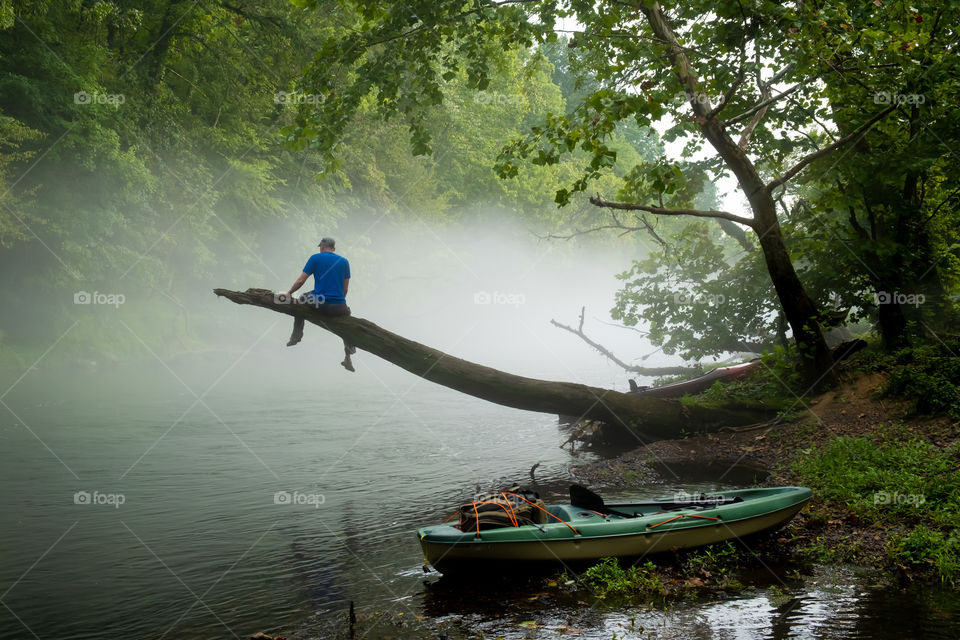 Foap, Landscapes of 2019: An adventurist takes a break to enjoy the view over a misty Elk River near Winchester, Tennessee. 