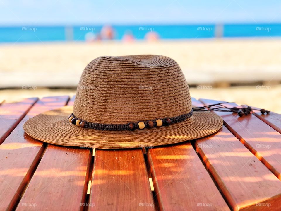Hat on a table at the beach