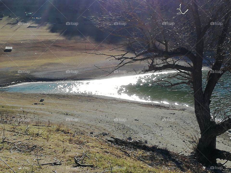 Turano lake. The sun reflect itself