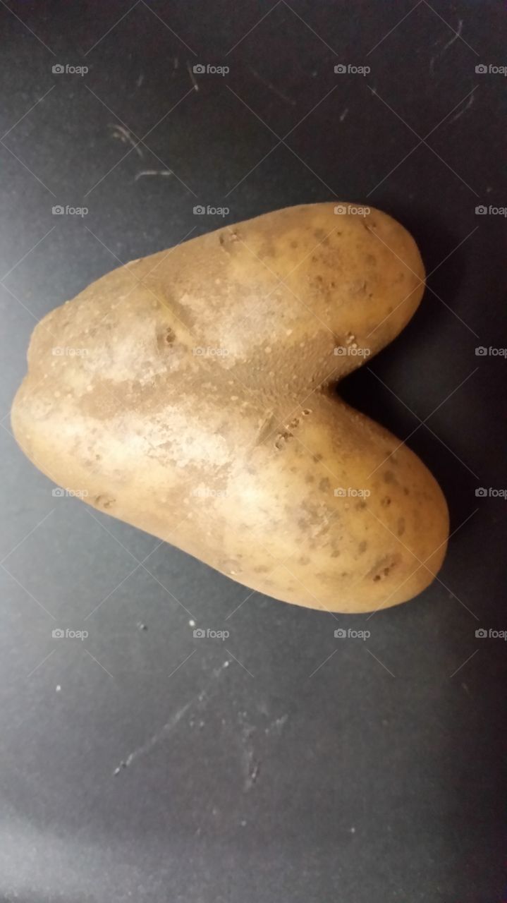 Potato heart. found this in a bag of potatoes I was peeling. .I call it a potato heart