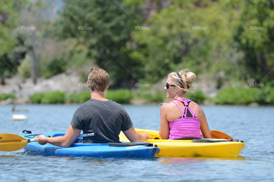 young couple kayaking