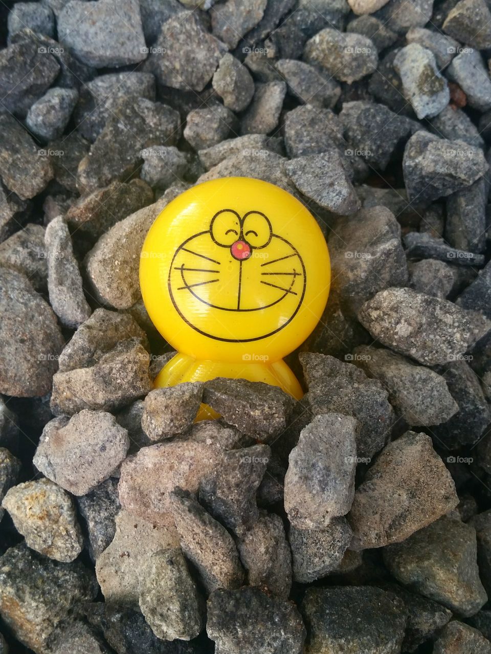 Doremon toy and stones