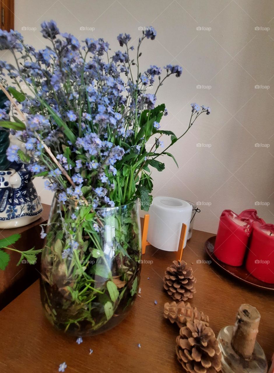 forget-me-nots in green vase