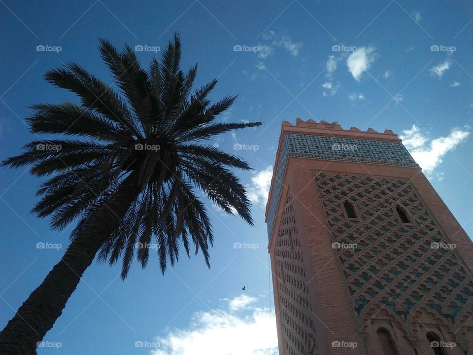 Beautiful and ancient minaret of kasbah mosque at marrakech city in Morocco.