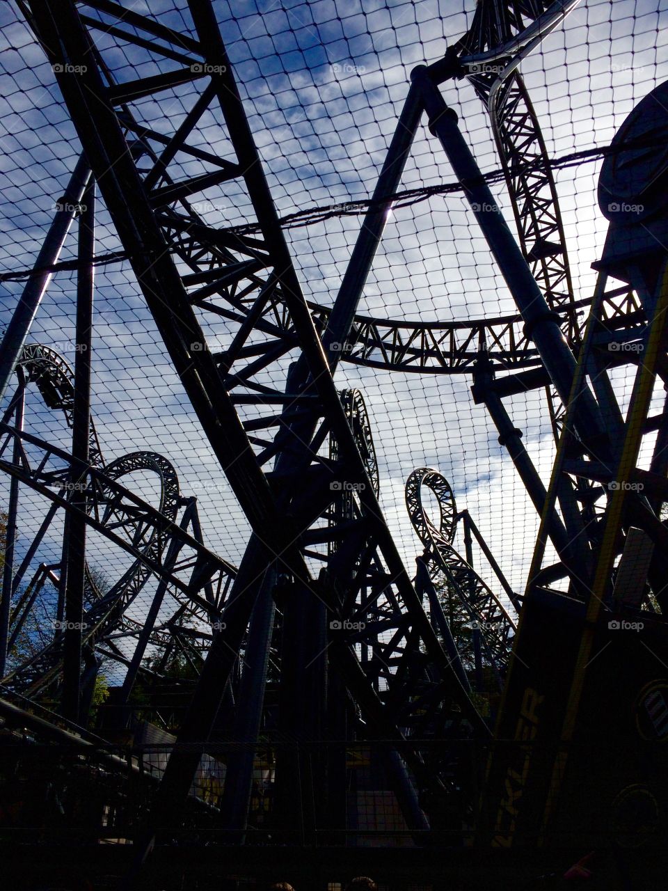 The Smiler rollercoaster Alton Towers Staffordshire, taken while queuing to ride. Beautifully silhouetted. 