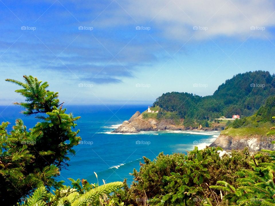 Scenic view of a beach against cloudy sky