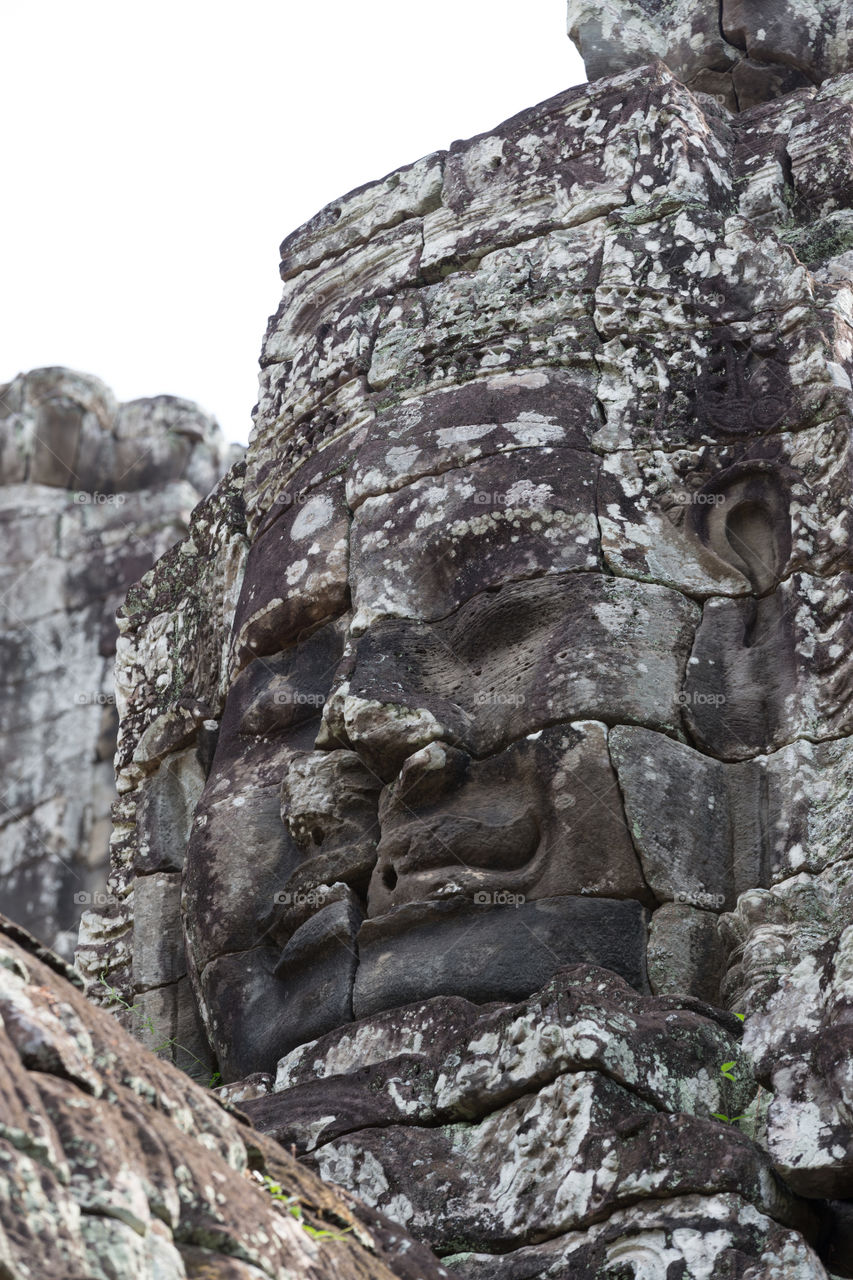 Carving head inside Bayon temple in Siem Reap Cambodia 