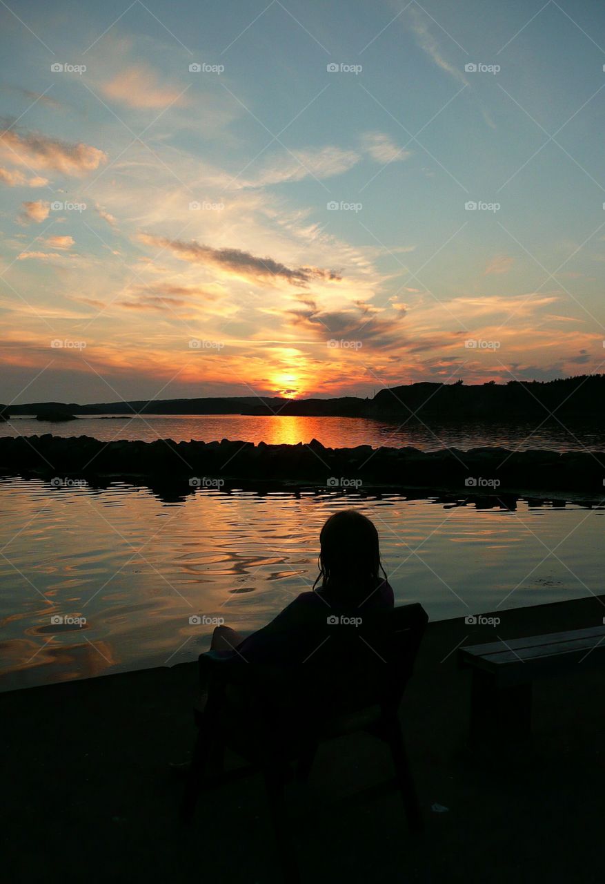 Watching the sun set after a bath in the sea