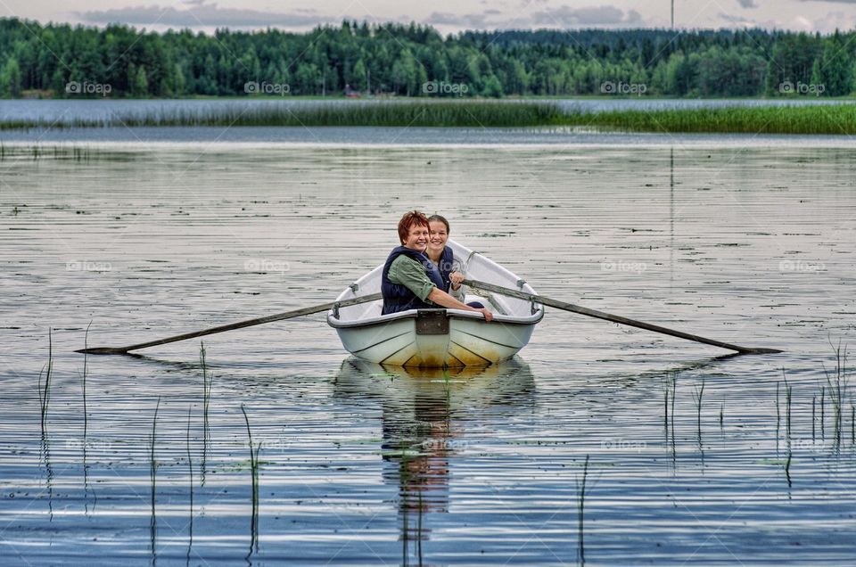 Mother and daughter enjoying in boating