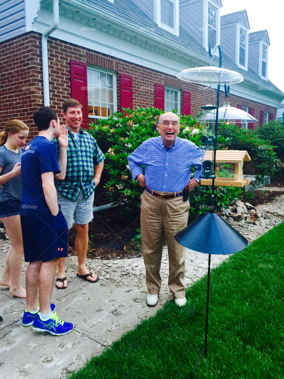 Multi generation happy family standing in park