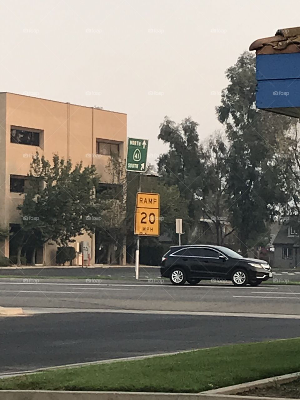 Street signs and a vehicle.