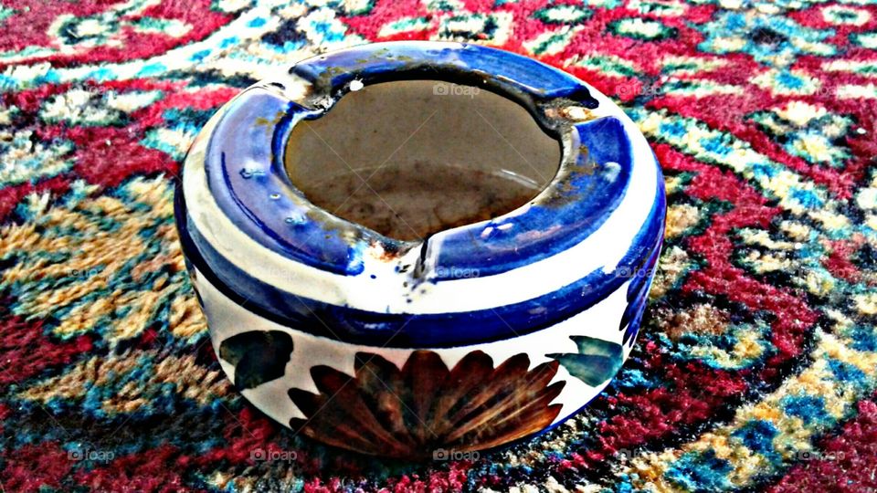 beautiful antique ashtray 
An ashtray is a receptacle for ash from cigarettes and cigars. Ashtrays are typically made of fire retardant material such as glass, heat-resistant plastic, pottery, metal, or stone.