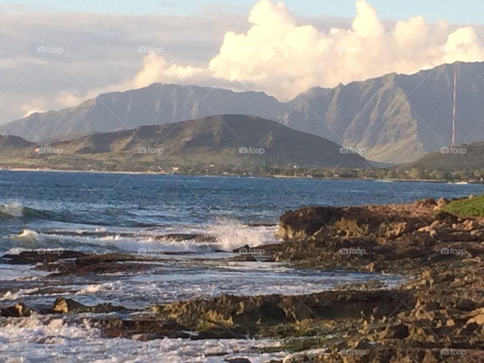 Hawaiian sea, rocks, and mountains 