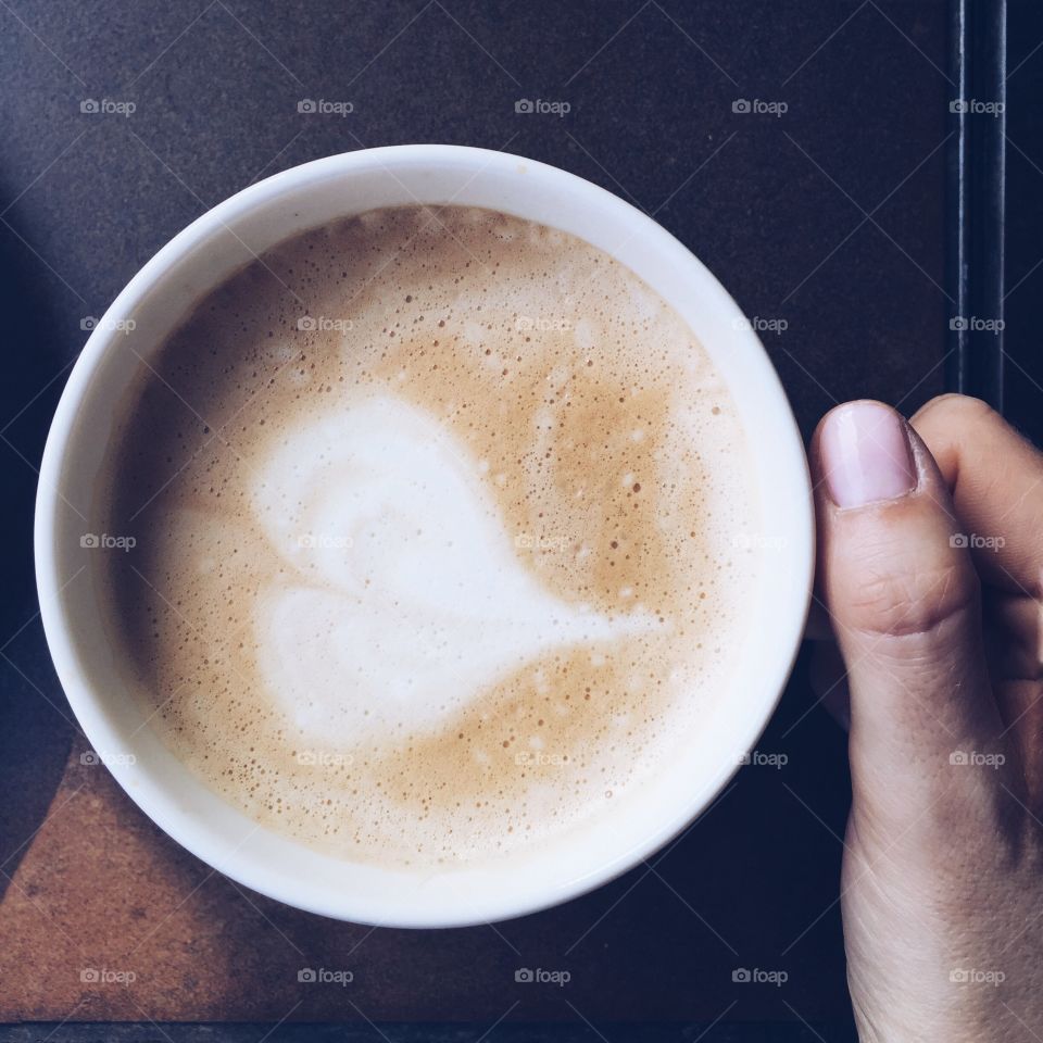 Directly above view of person holding coffee