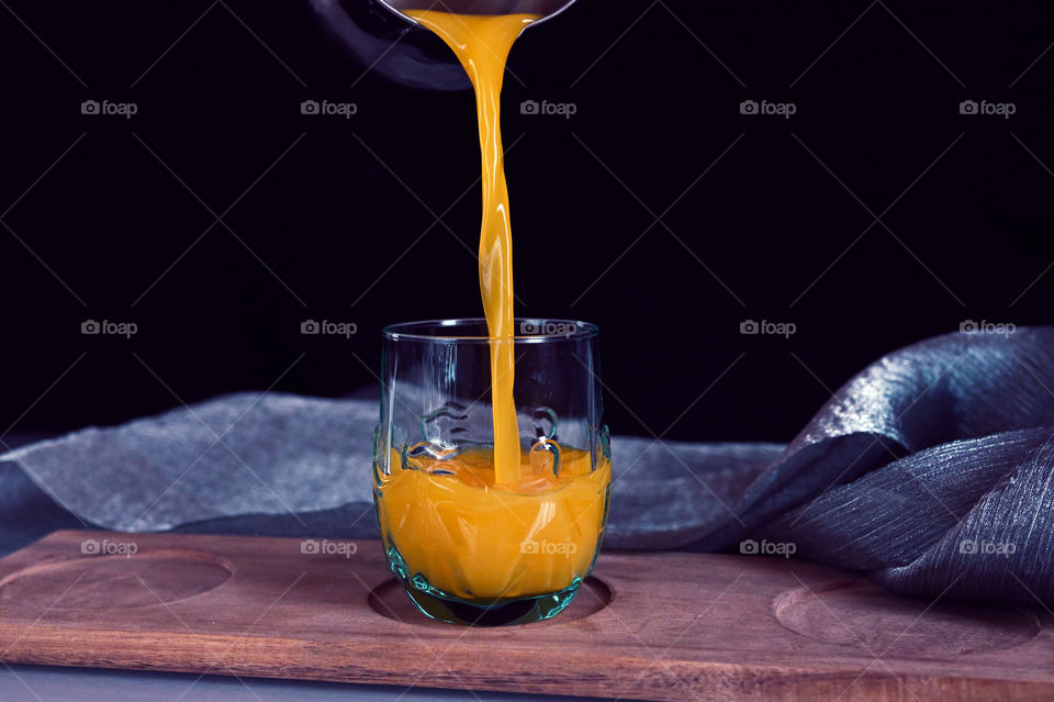 Orange juice the moment it is poured into the glass
