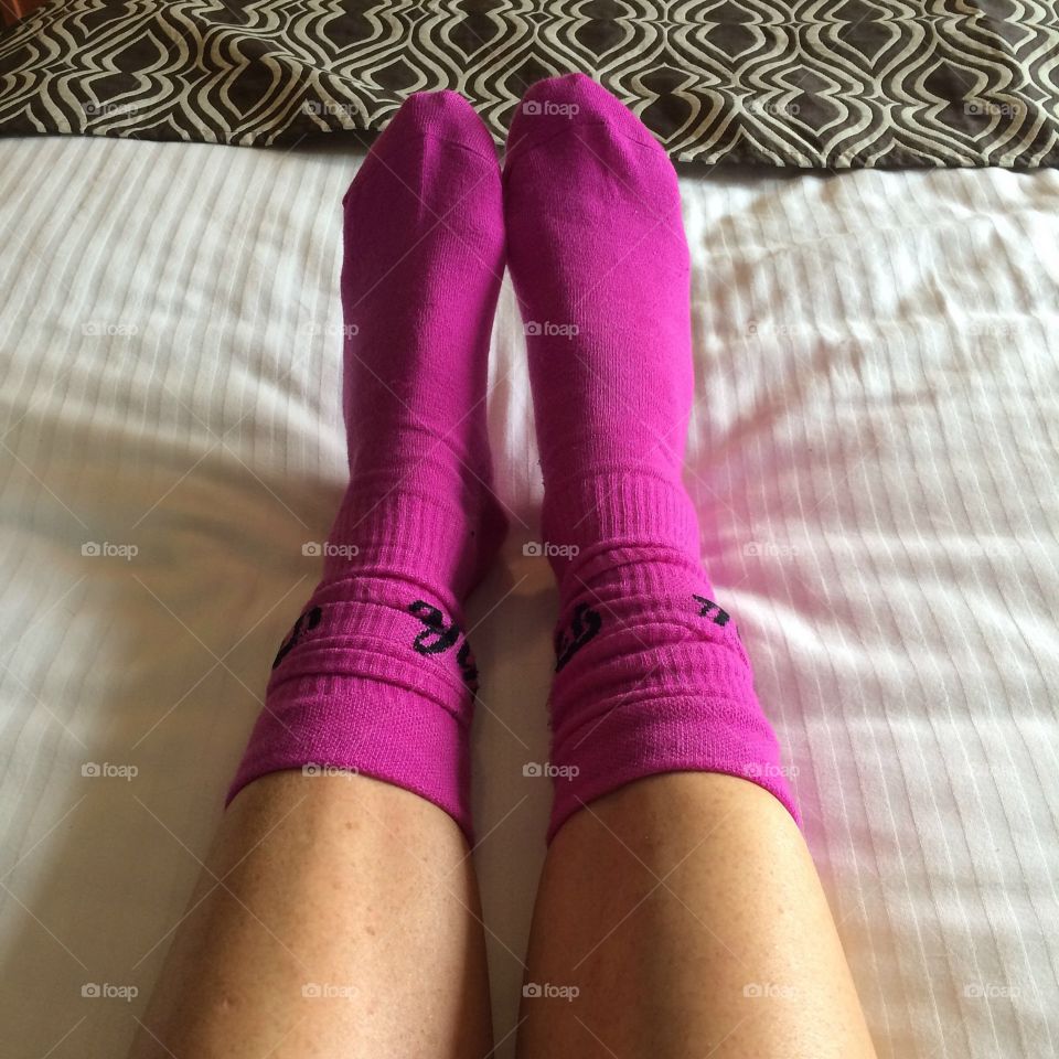 Pink socks cozy bed